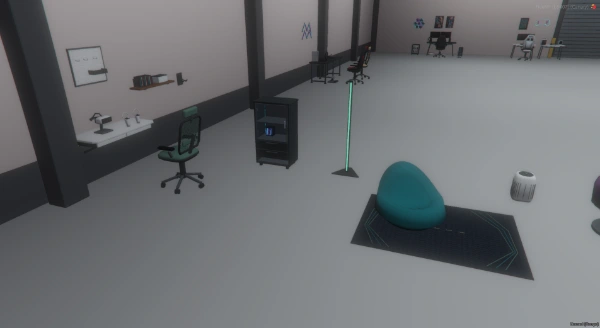 FiveM screenshot showing the beanbag lounger on the geometric rug, a wall desk, lamp and room accessories